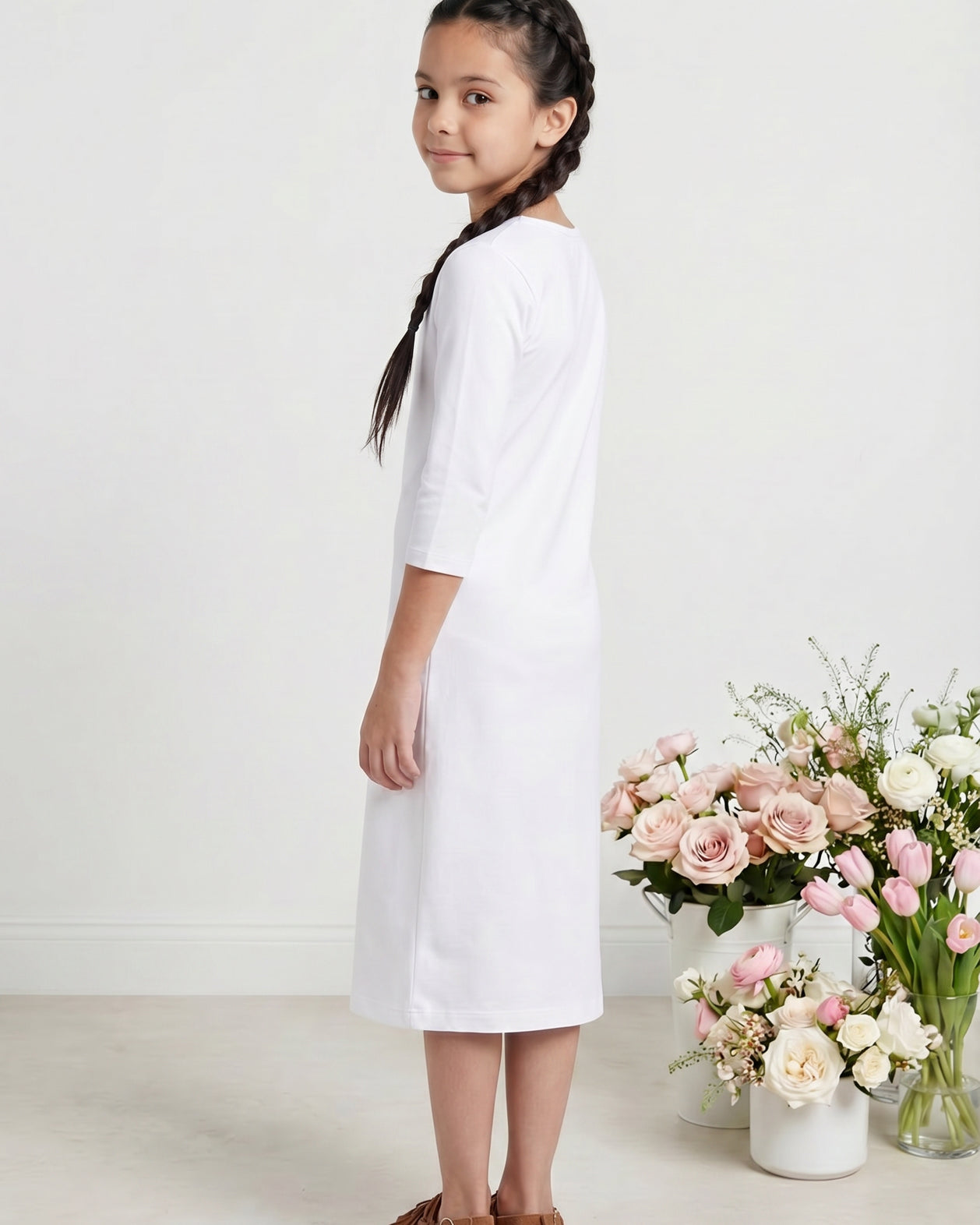 Model wearing Nuggles® Girls Midi Layering Dress in White