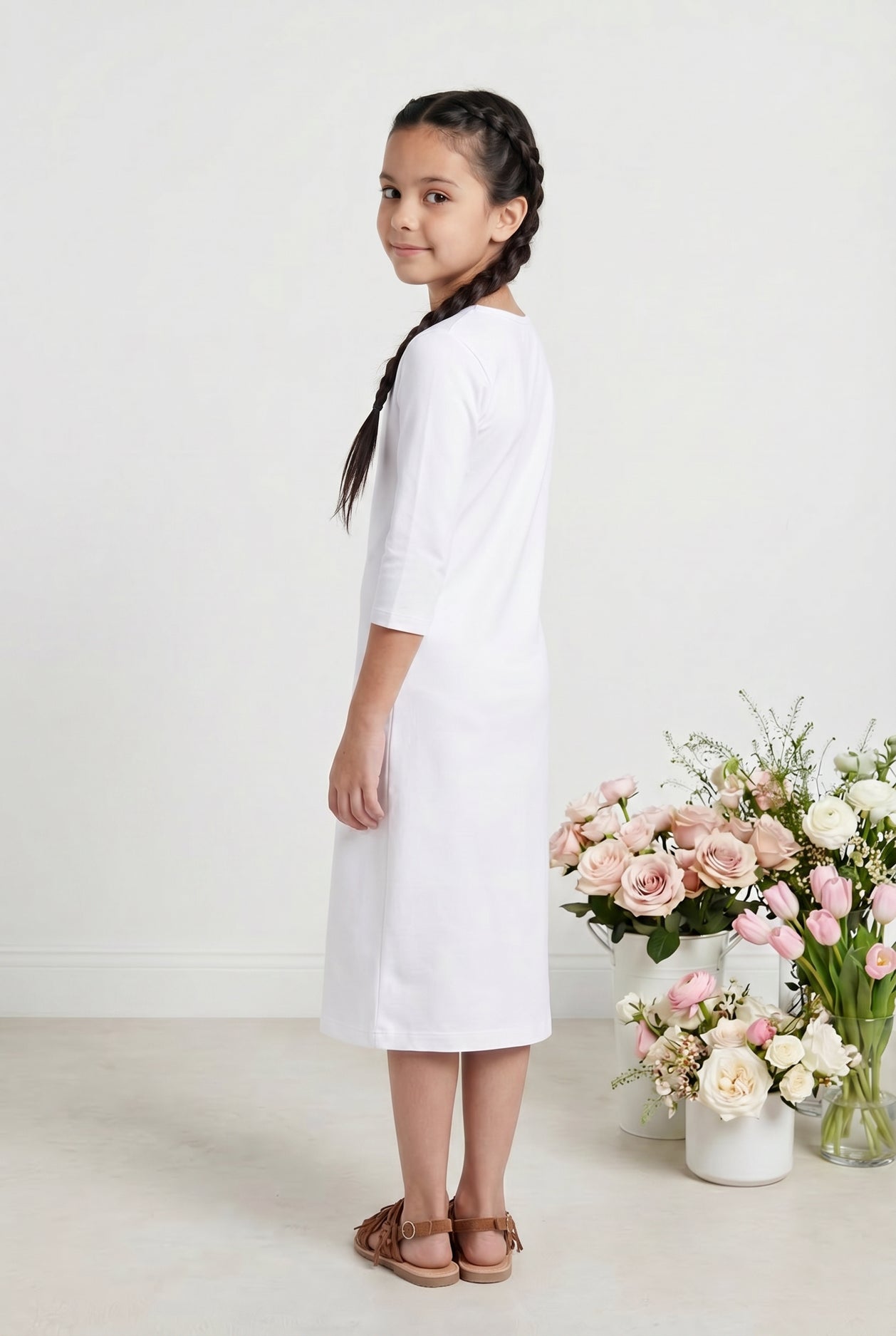Model wearing Nuggles® Girls Midi Layering Dress in White