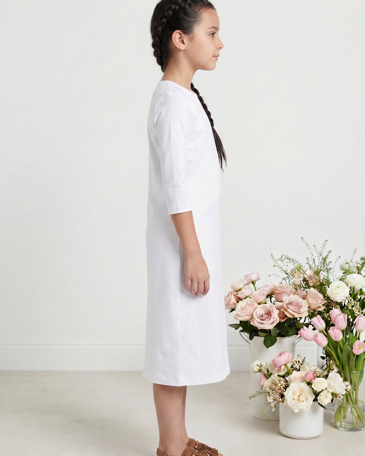 Model wearing Nuggles® Girls Midi Layering Dress in White