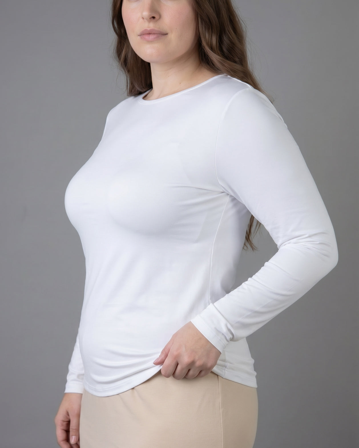 Model wearing Nuggles® Long Sleeve Essential Tee in White