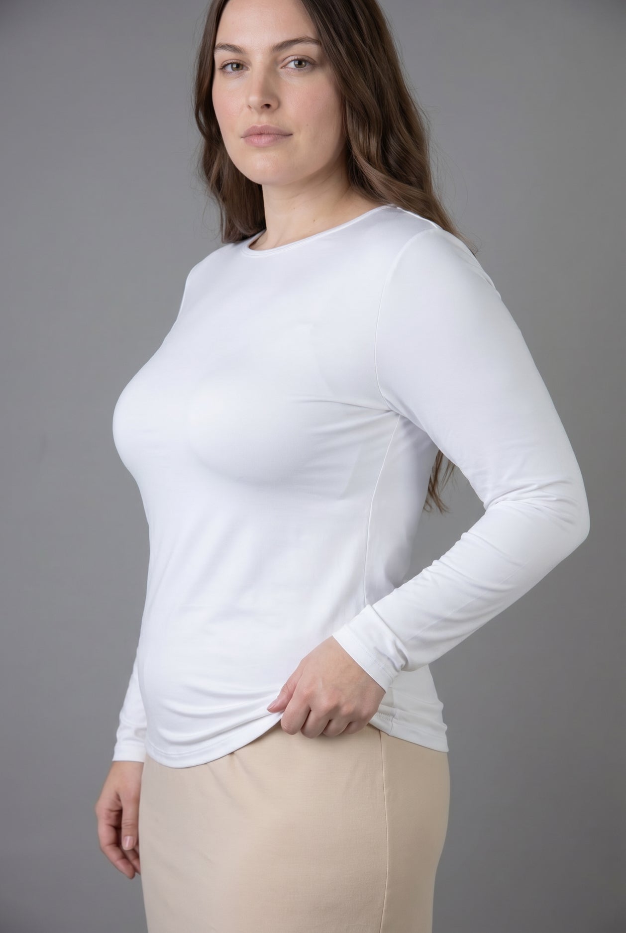 Model wearing Nuggles® Long Sleeve Essential Tee in White