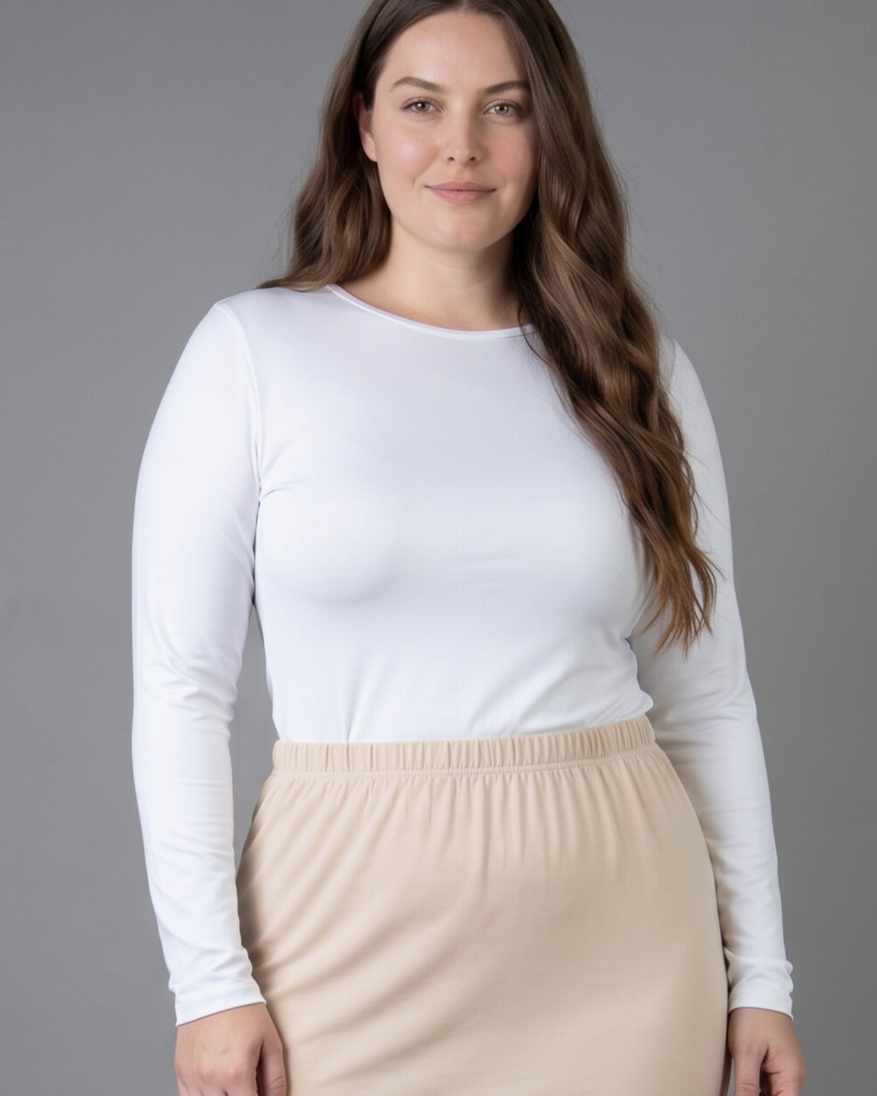Model wearing Nuggles® Long Sleeve Essential Tee in White