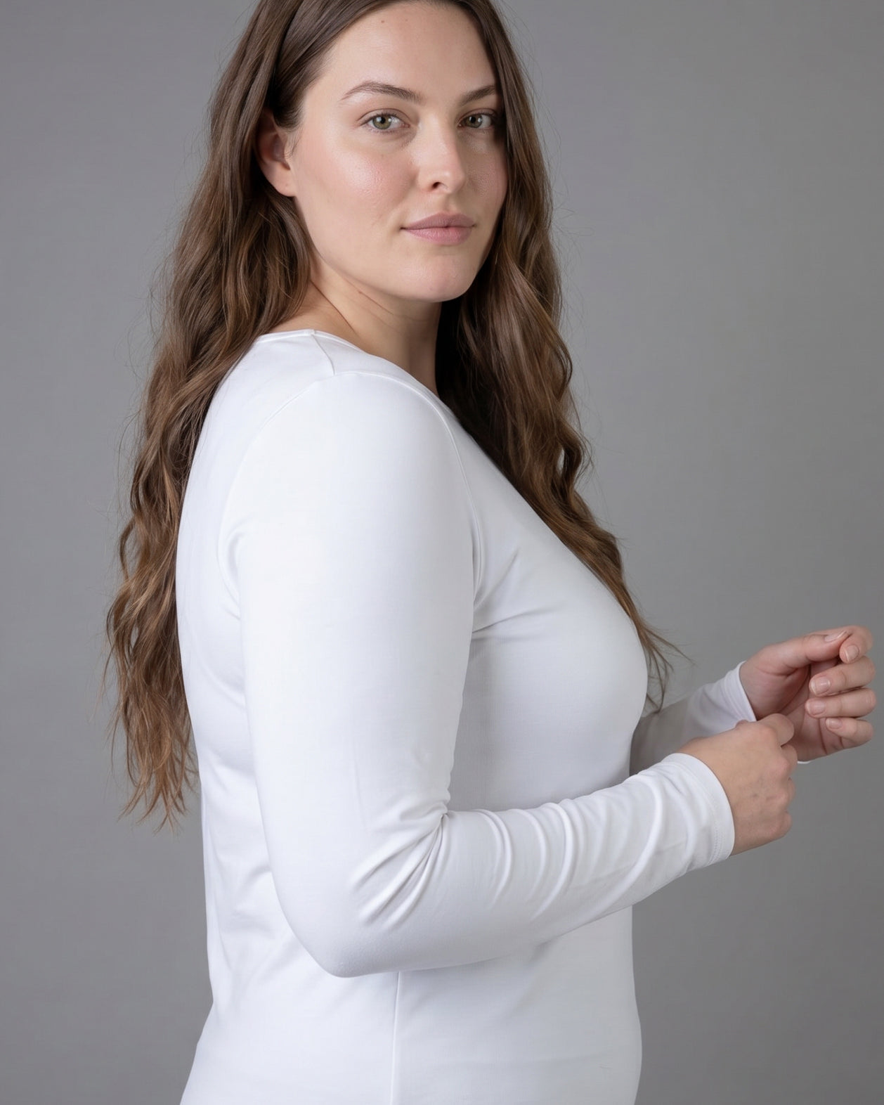 Model wearing Nuggles® Long Sleeve Essential Tee in White