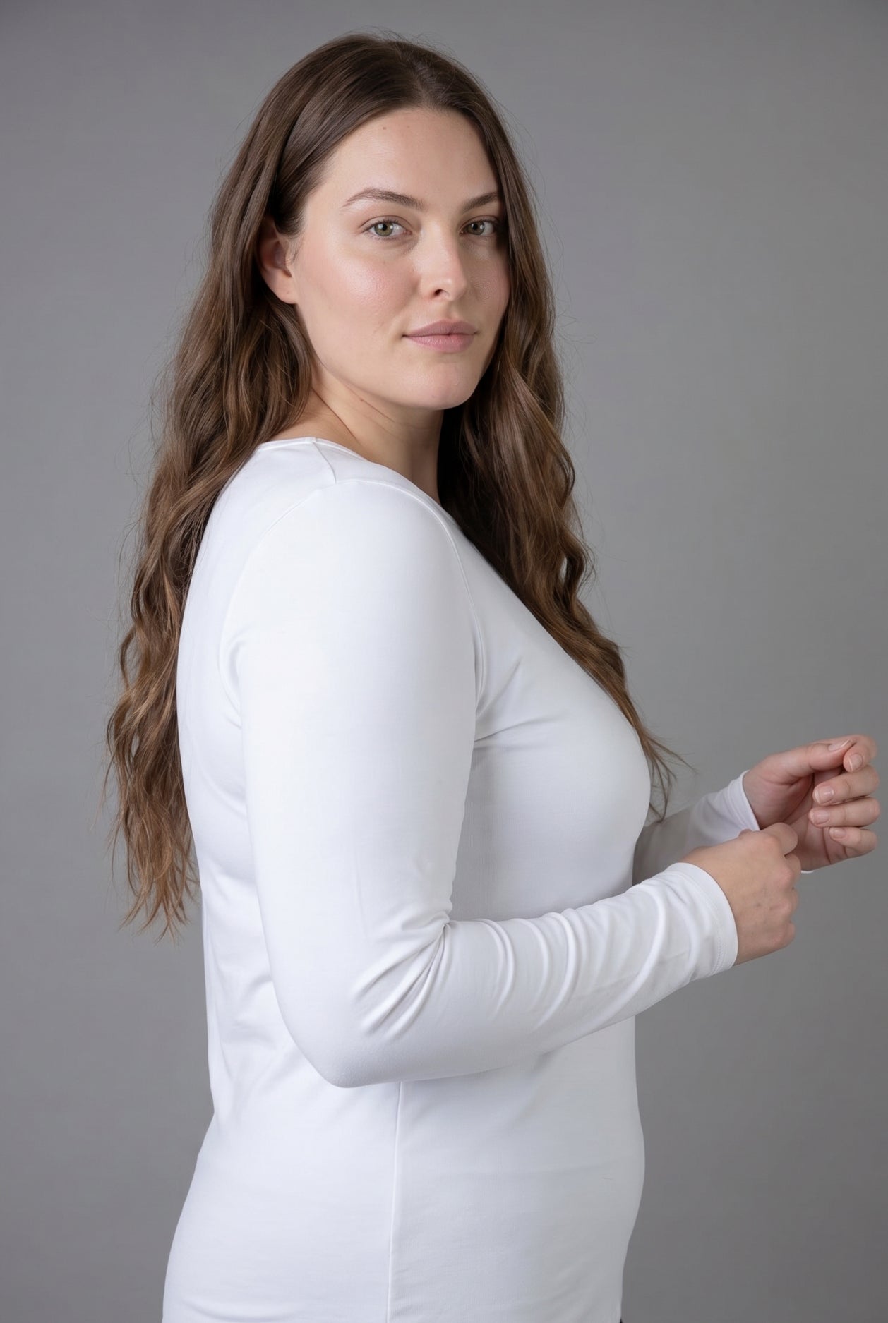 Model wearing Nuggles® Long Sleeve Essential Tee in White