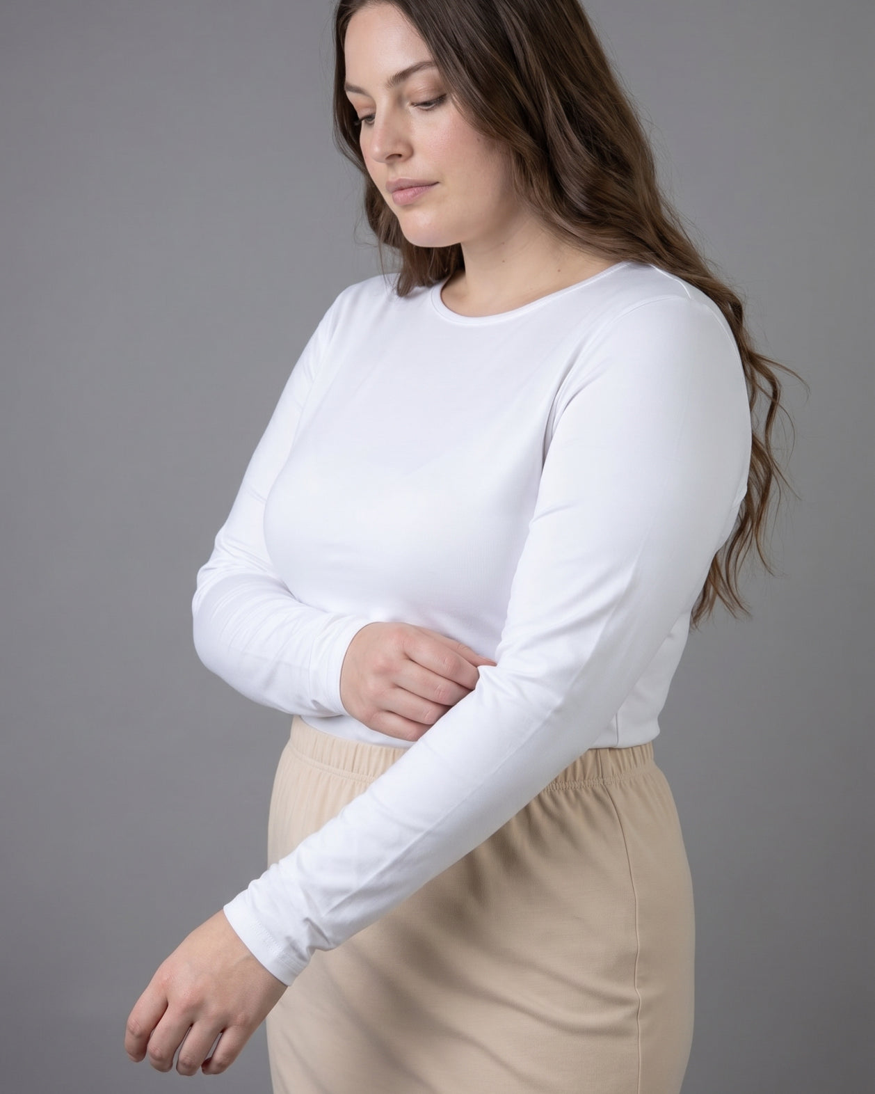 Model wearing Nuggles® Long Sleeve Essential Tee in White
