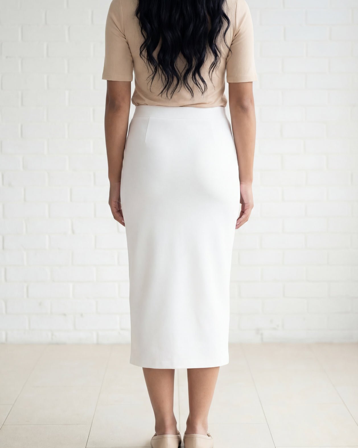 Model wearing Nuggles® 31" Relaxed Skirt in White