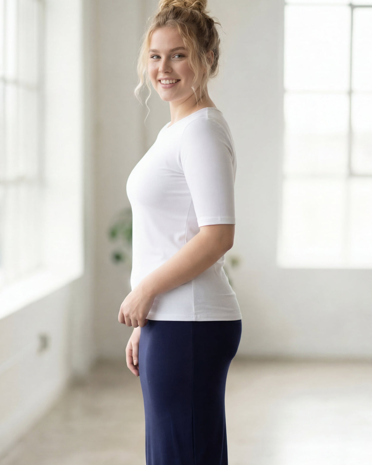 Model wearing the Nuggles® Essential Half Sleeve Tee in White