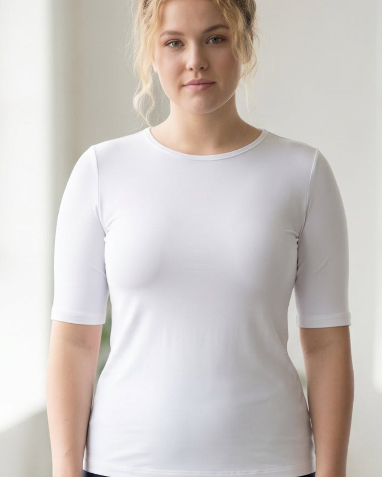 Model wearing the Nuggles® Essential Half Sleeve Tee in White