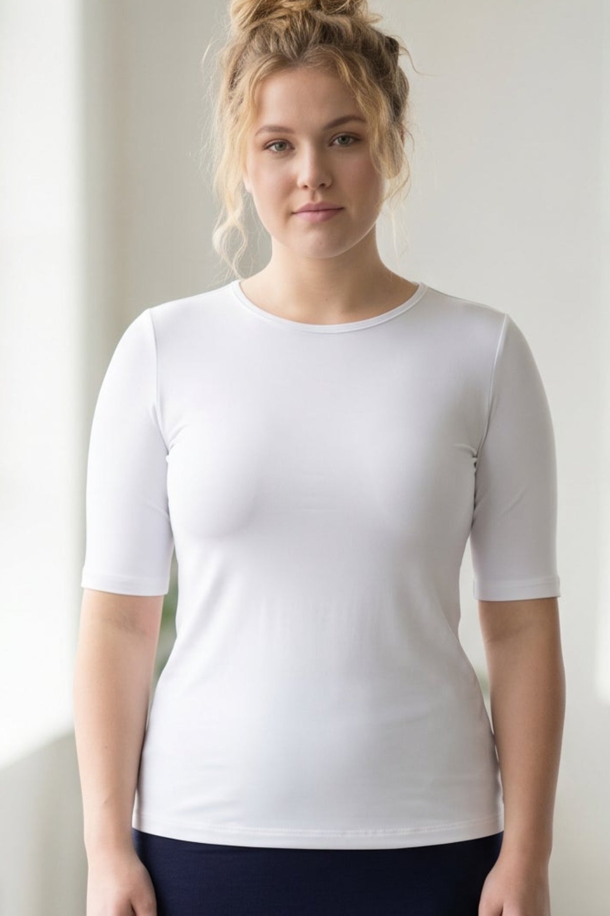 Model wearing the Nuggles® Essential Half Sleeve Tee in White