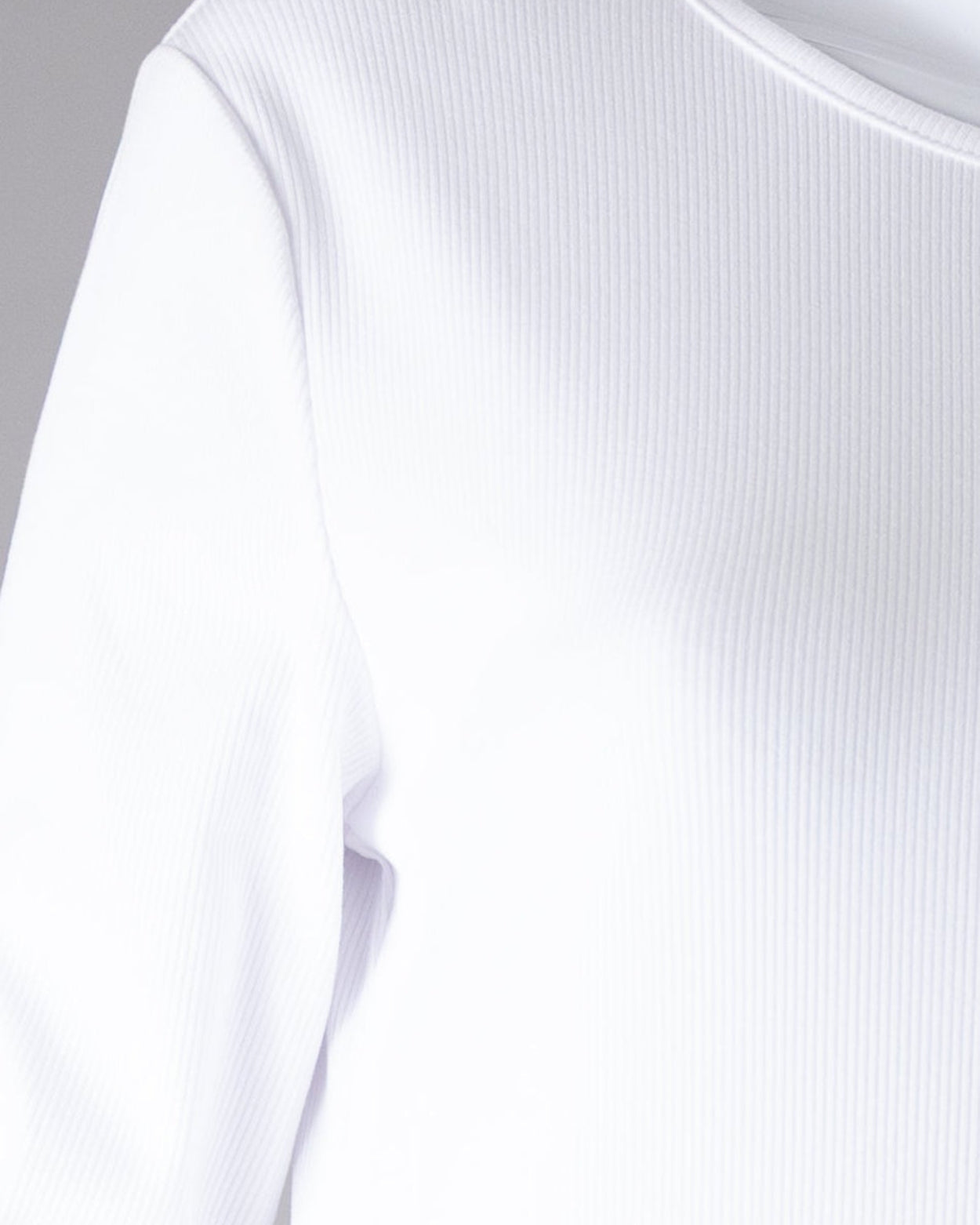 Model wearing Nuggles® Ribbed Layering Dress in White