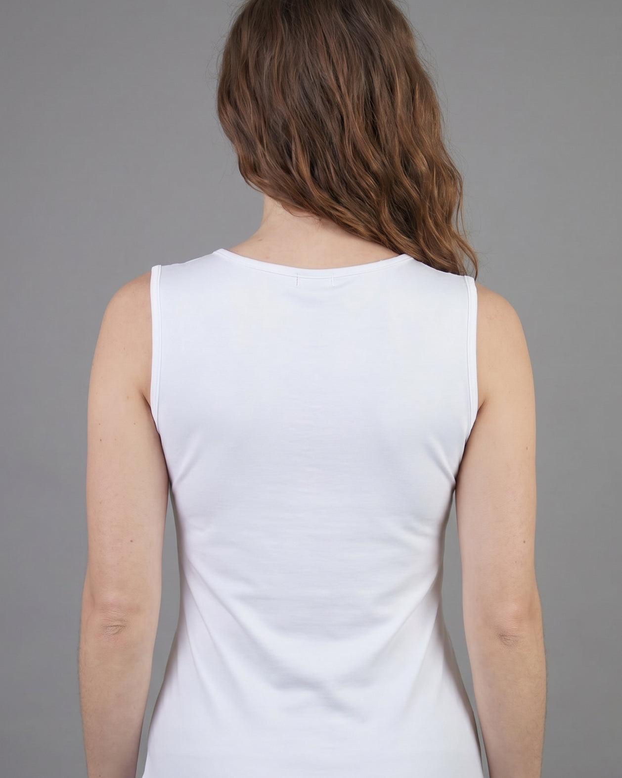 Model wearing Nuggles® Essential Tank in White