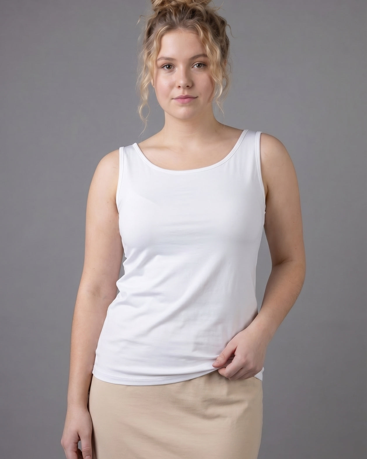 Model wearing Nuggles® Wide Neck Tank in White