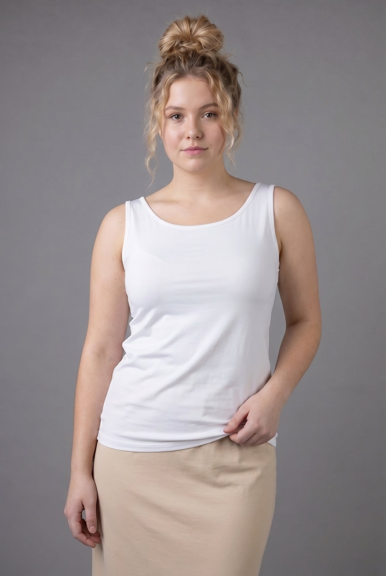 Model wearing Nuggles® Wide Neck Tank in White