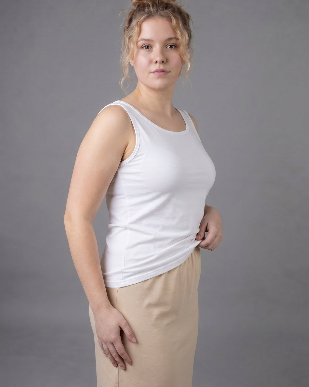 Model wearing Nuggles® Wide Neck Tank in White