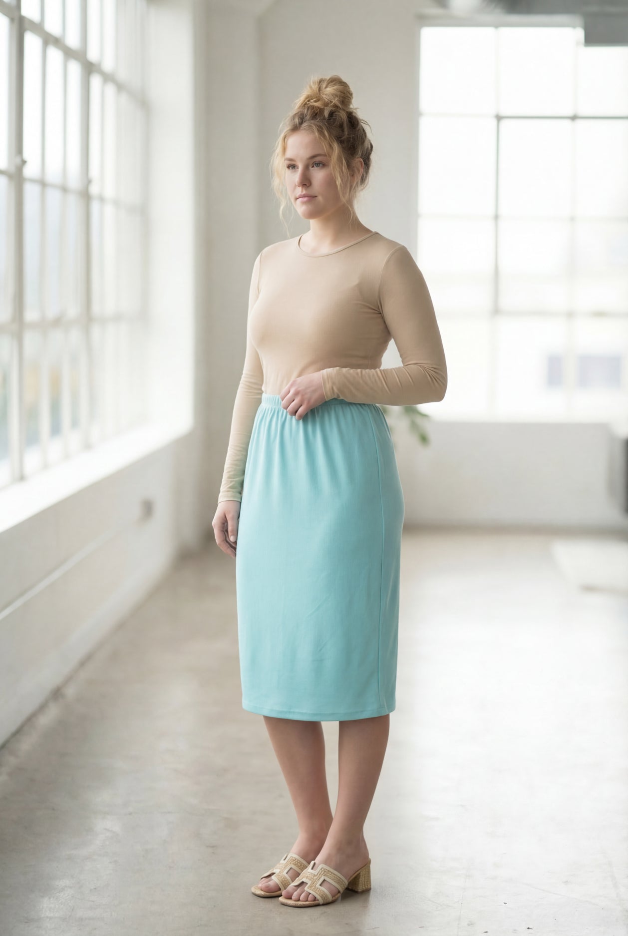 Model wearing Nuggles® 27" Classic Skirt in Aqua