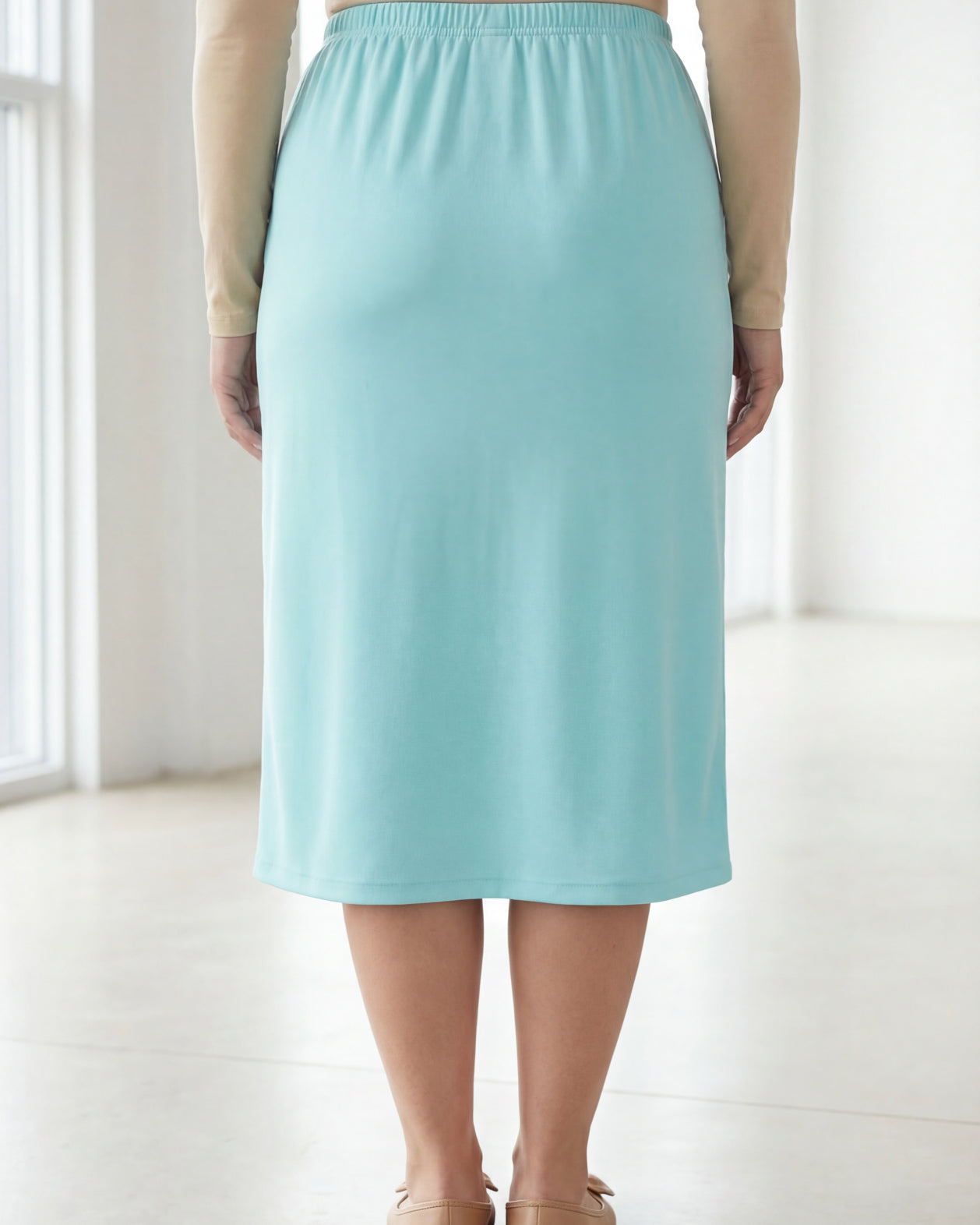 Model wearing Nuggles® 31" Classic Skirt in Aqua