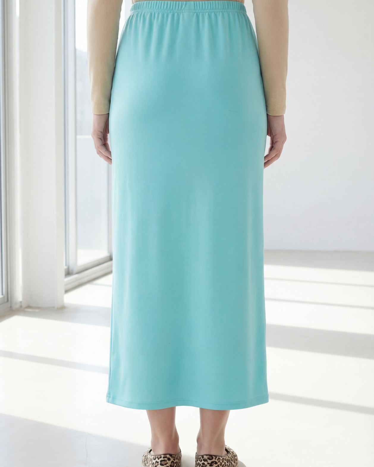 Model wearing Nuggles® 36" Classic Skirt in Aqua