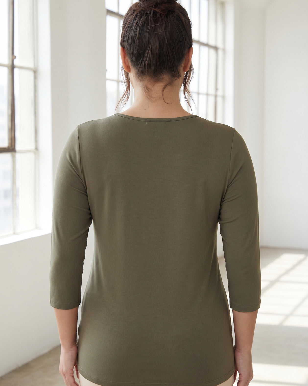 Model wearing Nuggles® Half Sleeve Essential Tee in Army Green