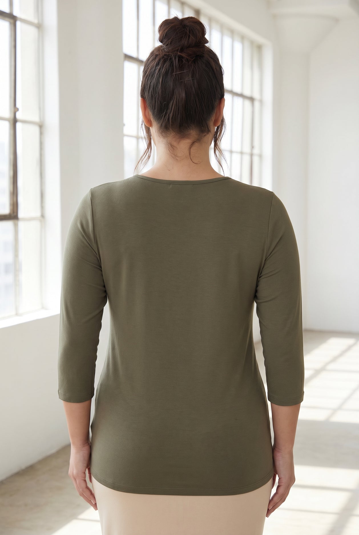 Model wearing Nuggles® Half Sleeve Essential Tee in Army Green