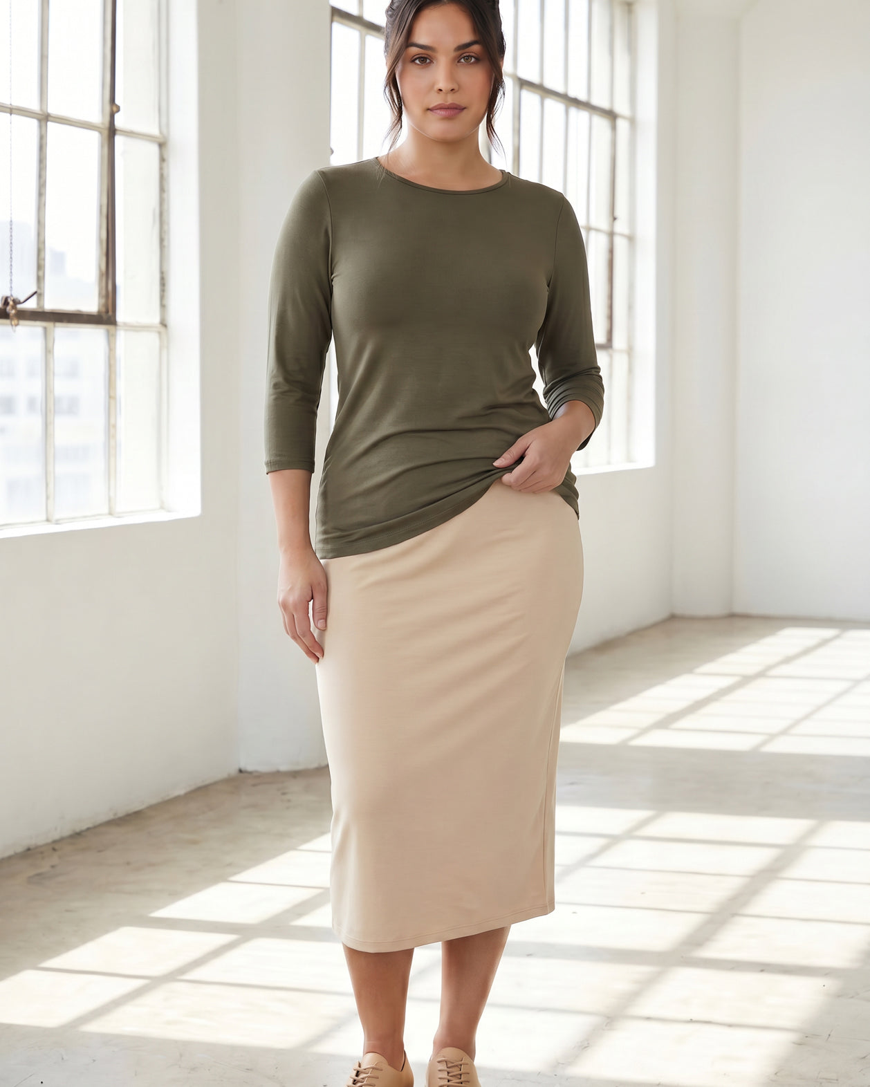 Model wearing Nuggles® Half Sleeve Essential Tee in Army Green