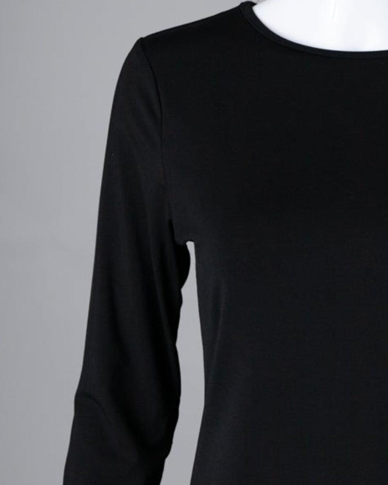Model wearing Nuggles® 3/4 Essential Tee in Black