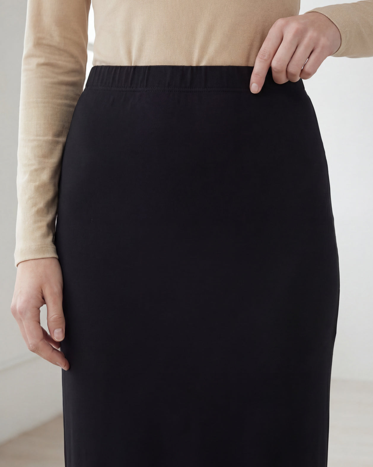 Model wearing Nuggles® 36" Classic Skirt in Black