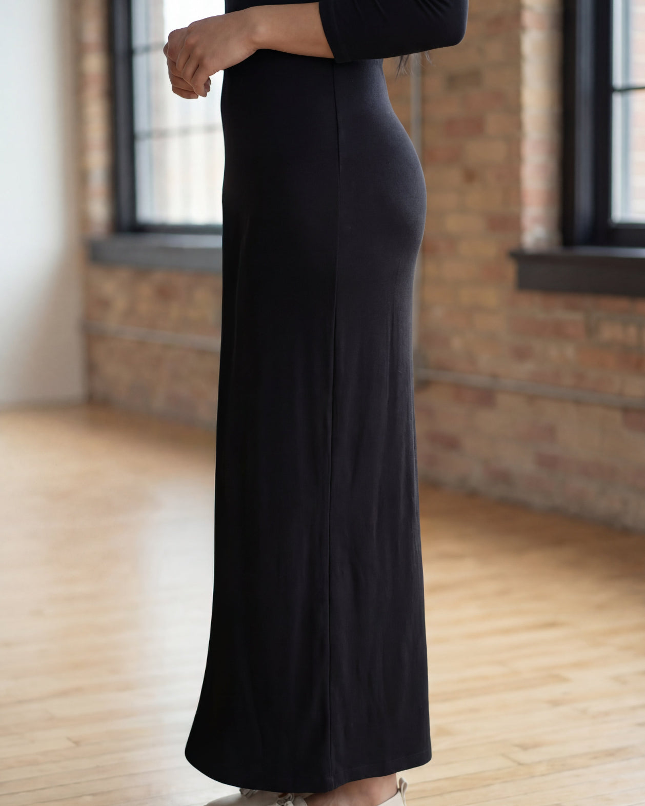 Model wearing Nuggles® Maxi Layering Dress in Black