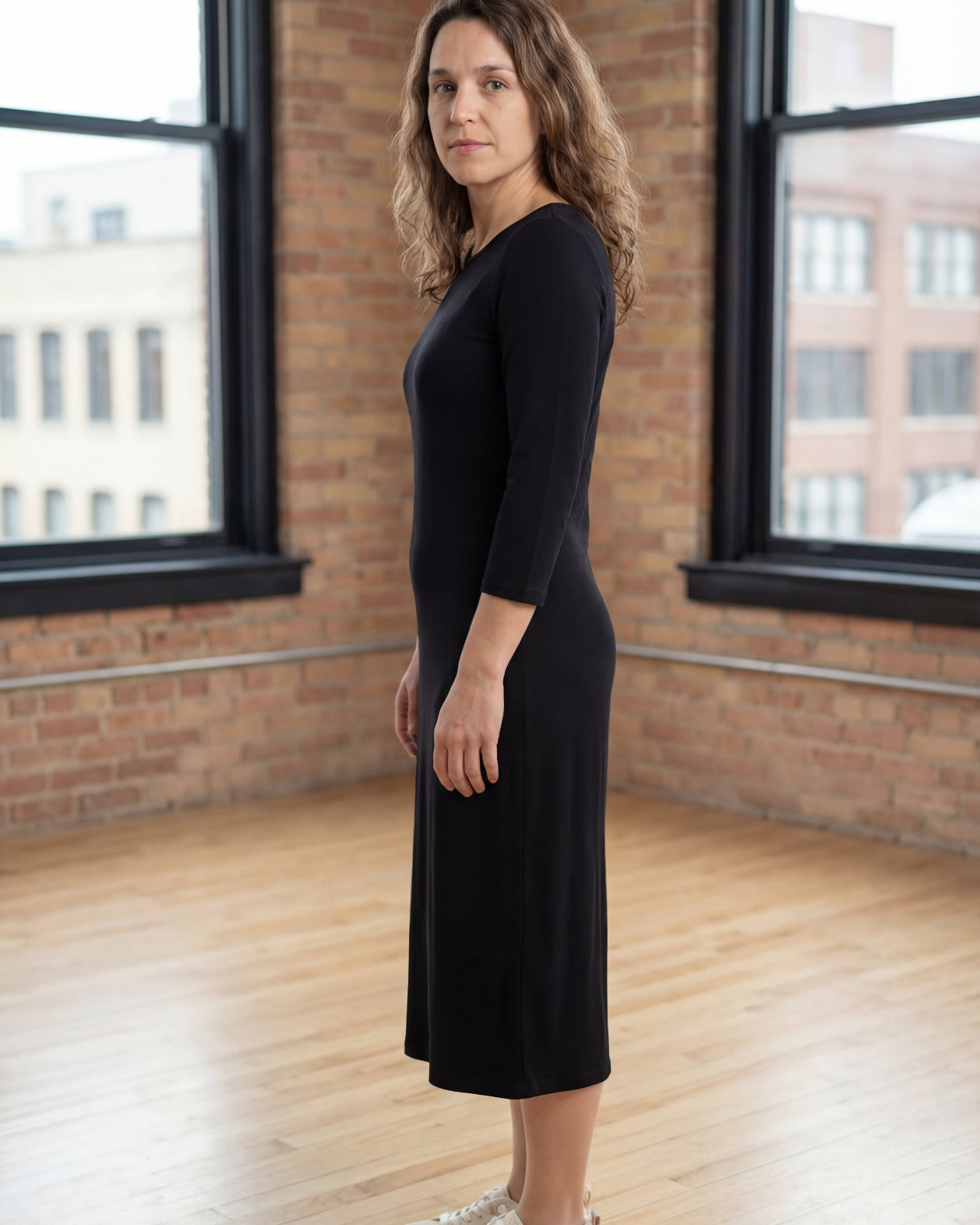 Model wearing Nuggles® Midi Layering Dress in Black