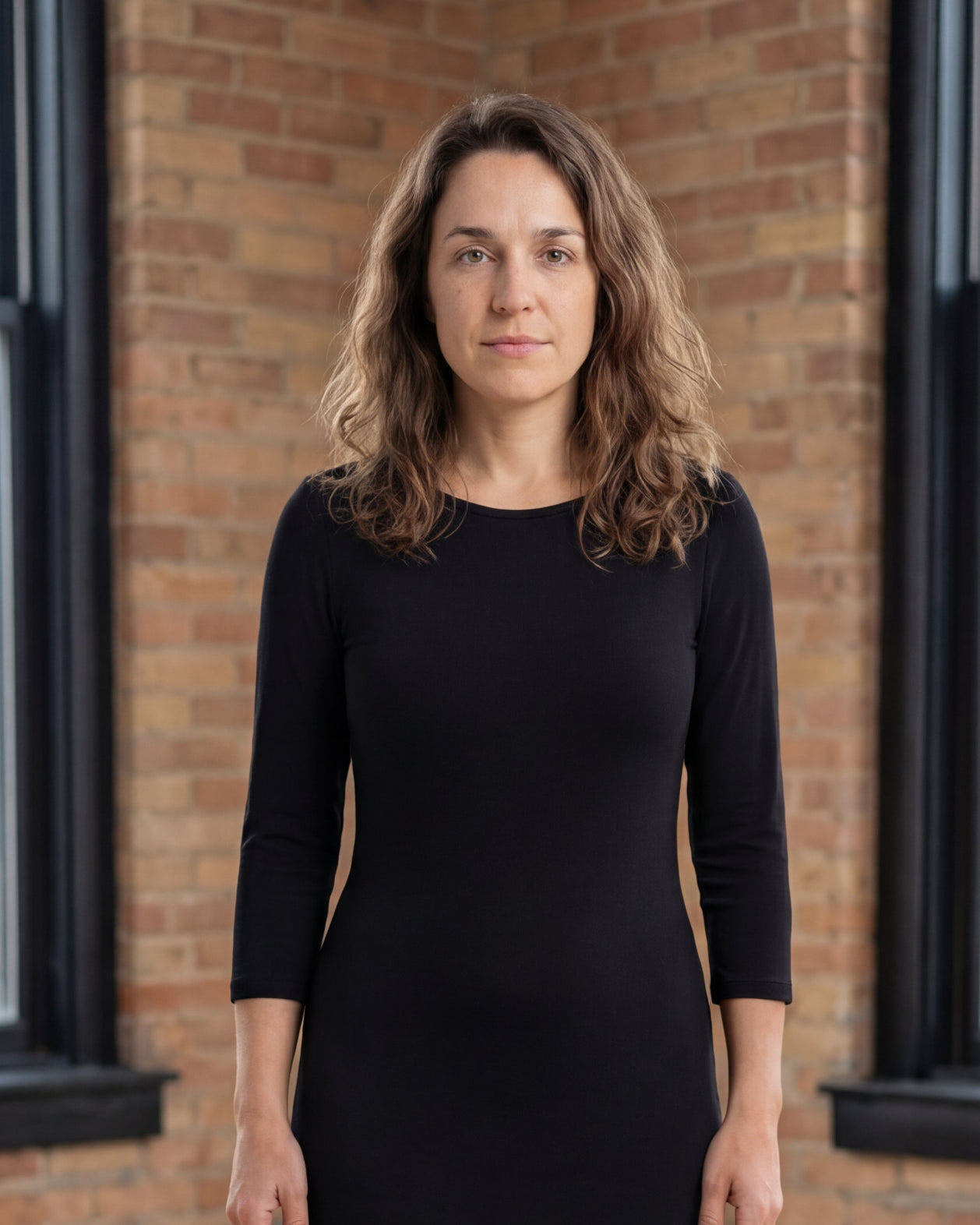 Model wearing Nuggles® Midi Layering Dress in Black