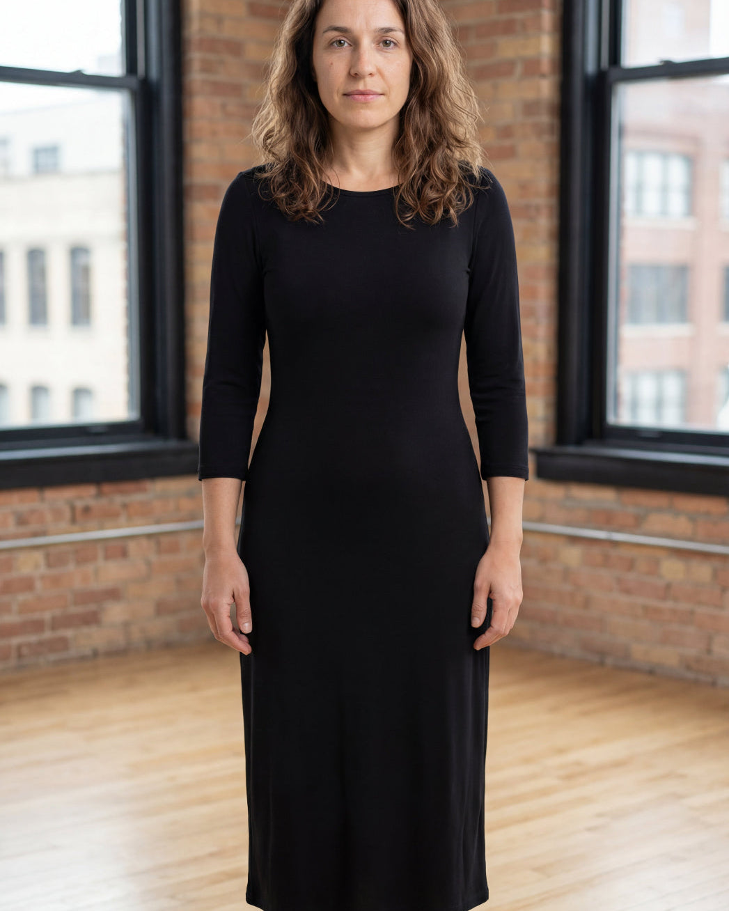 Model wearing Nuggles® Midi Layering Dress in Black