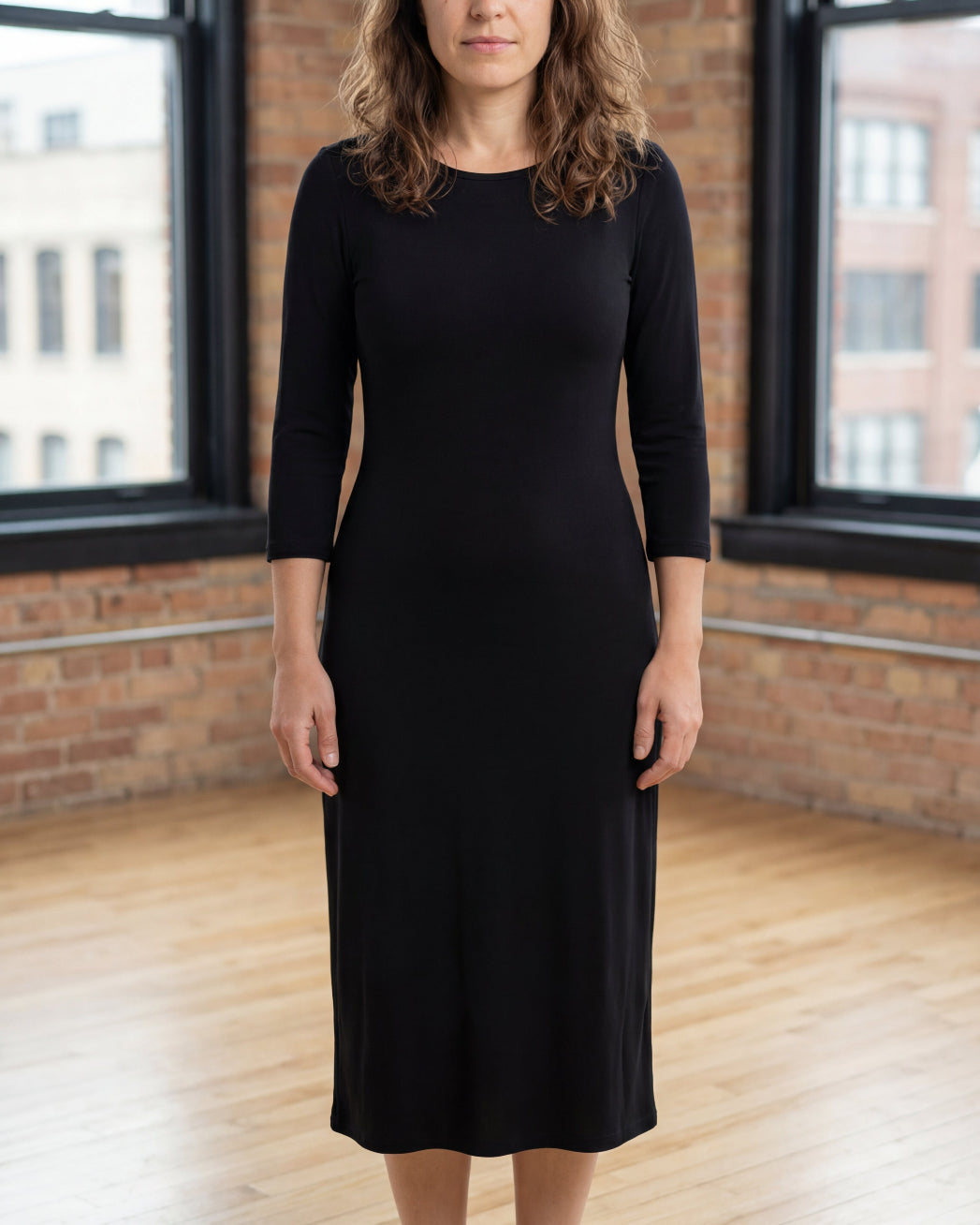 Model wearing Nuggles® Midi Layering Dress in Black