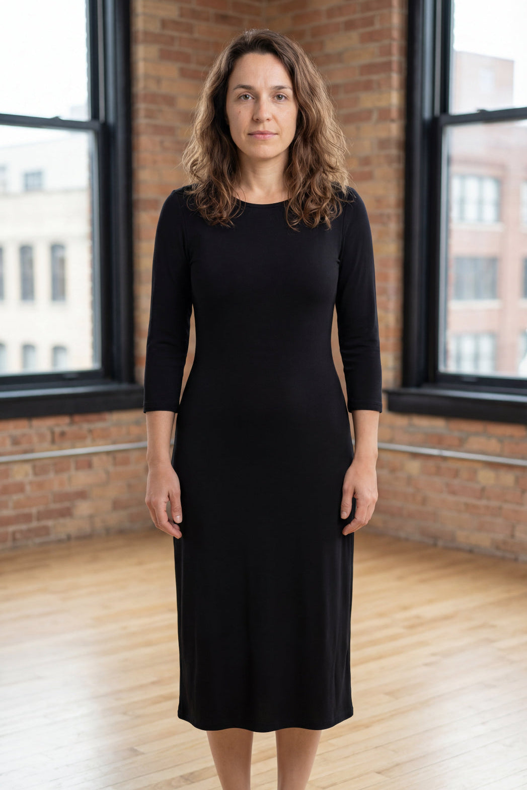 Model wearing Nuggles® Midi Layering Dress in Black