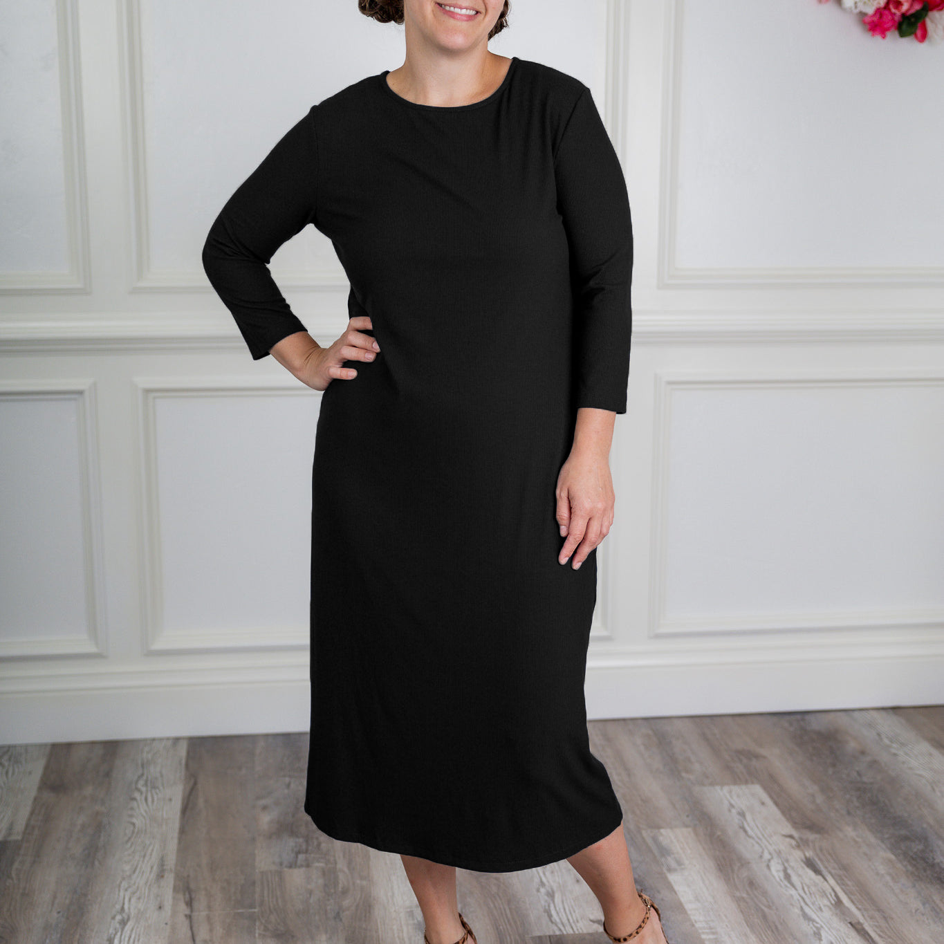 model wearing a ribbed midi dress from Nuggles® with modest 3/4 sleeves and high neckline.