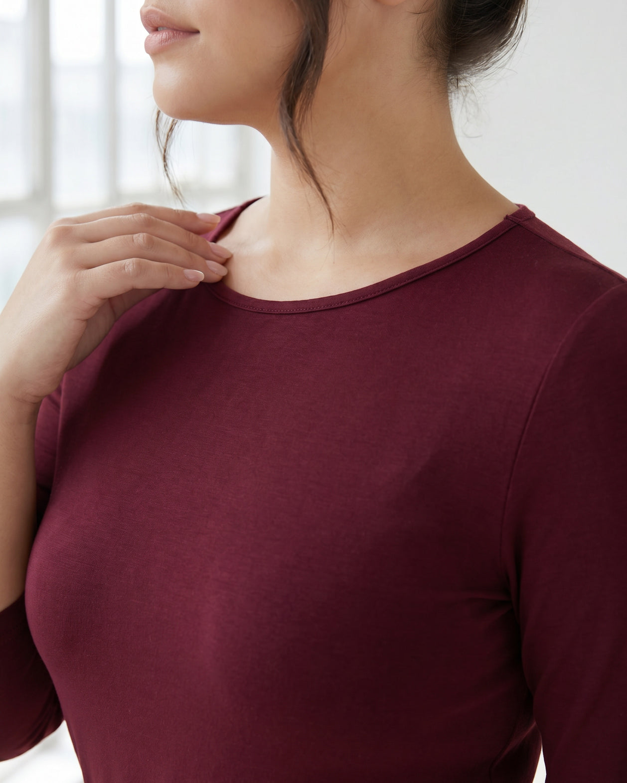 Model wearing Nuggles® Half Sleeve Essential Tee in Burgundy