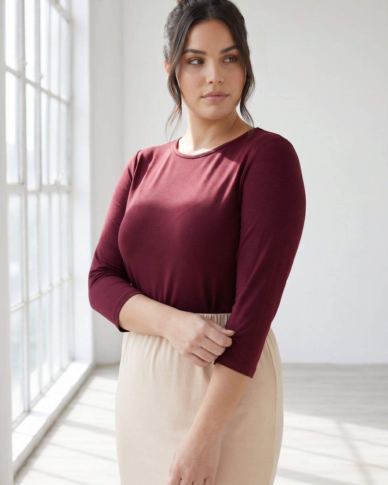 Model wearing Nuggles® Half Sleeve Essential Tee in Burgundy