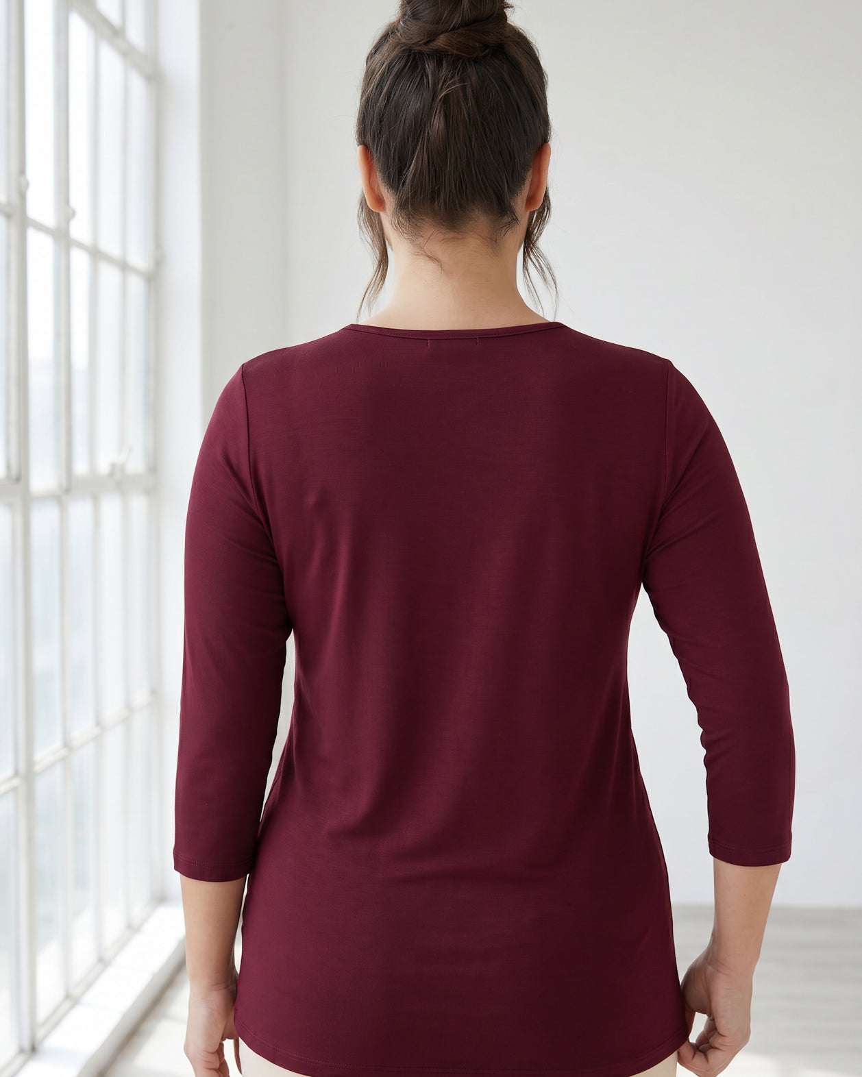 Model wearing Nuggles® Half Sleeve Essential Tee in Burgundy