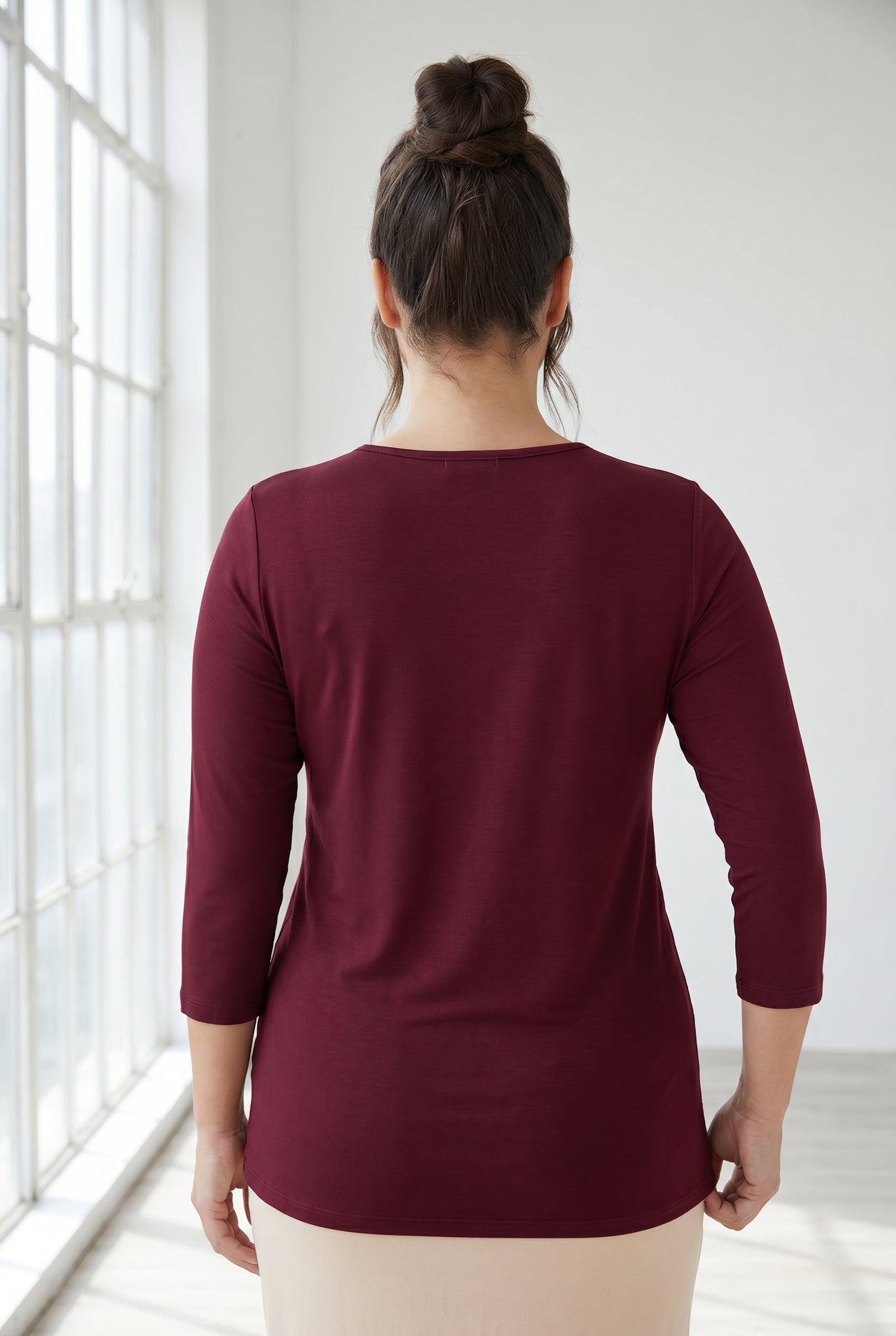 Model wearing Nuggles® Half Sleeve Essential Tee in Burgundy
