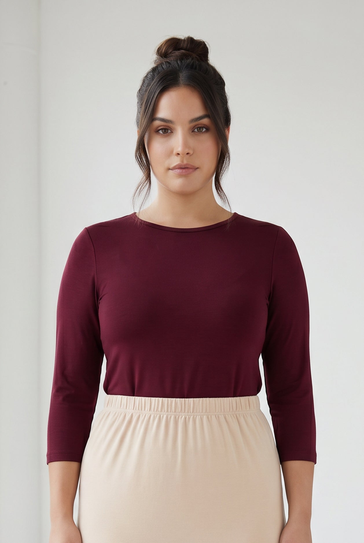 Model wearing Nuggles® Half Sleeve Essential Tee in Burgundy