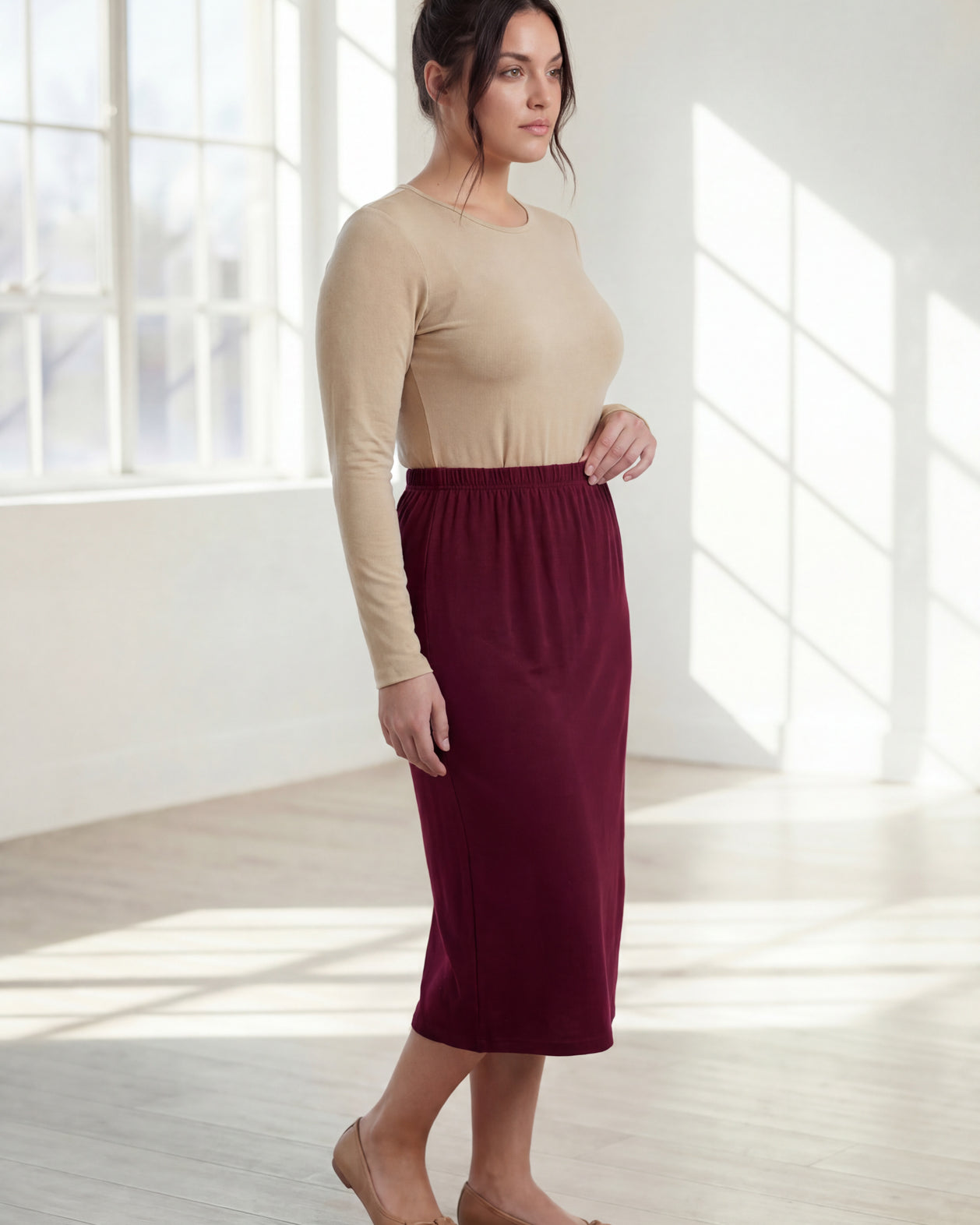 Model wearing Nuggles® 31" Classic Skirt in Burgundy