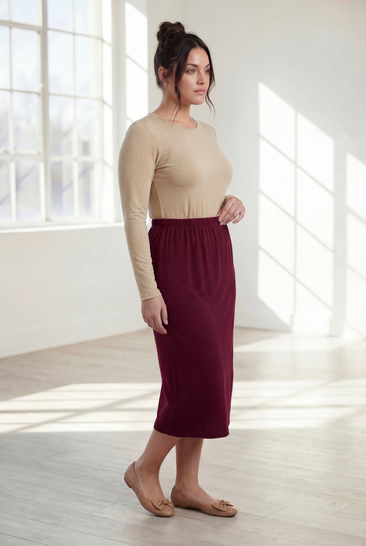 Model wearing Nuggles® 31" Classic Skirt in Burgundy