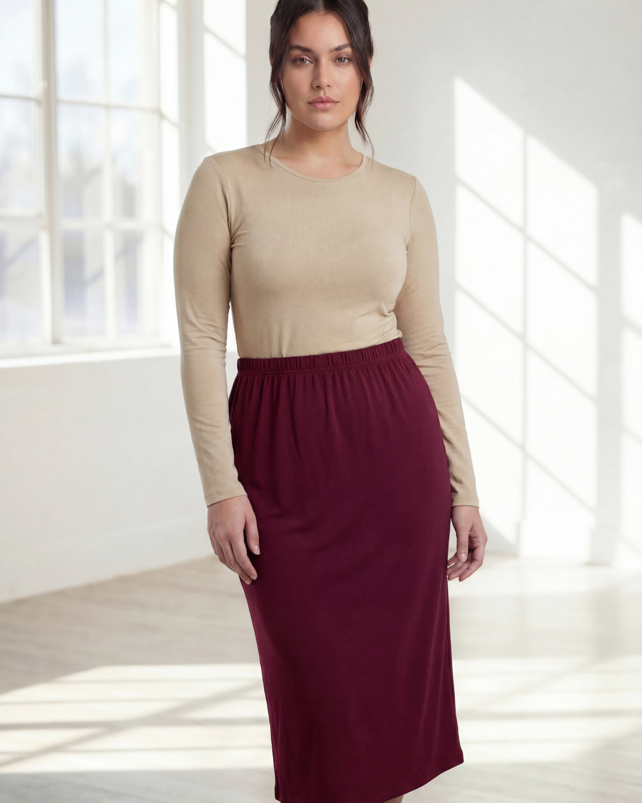 Model wearing Nuggles® 31" Classic Skirt in Burgundy