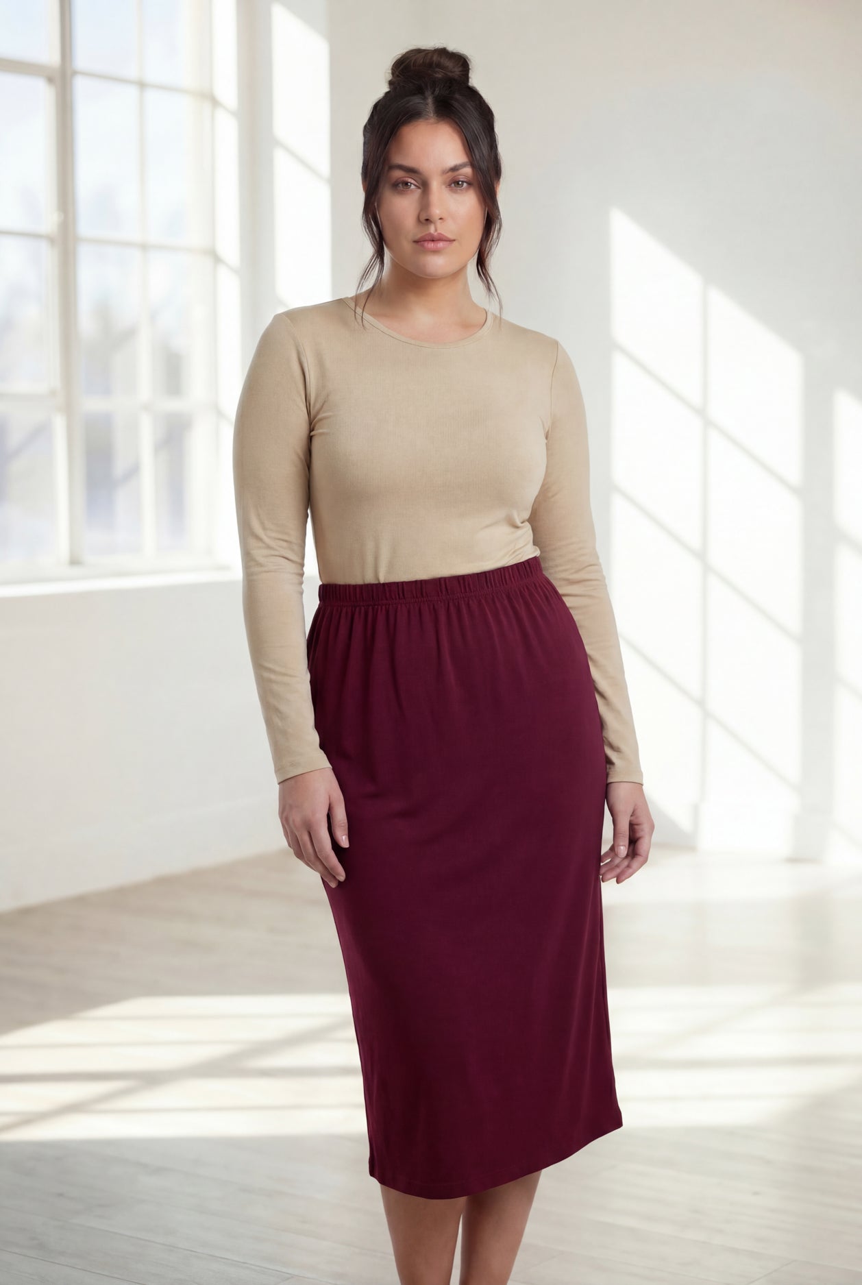 Model wearing Nuggles® 31" Classic Skirt in Burgundy