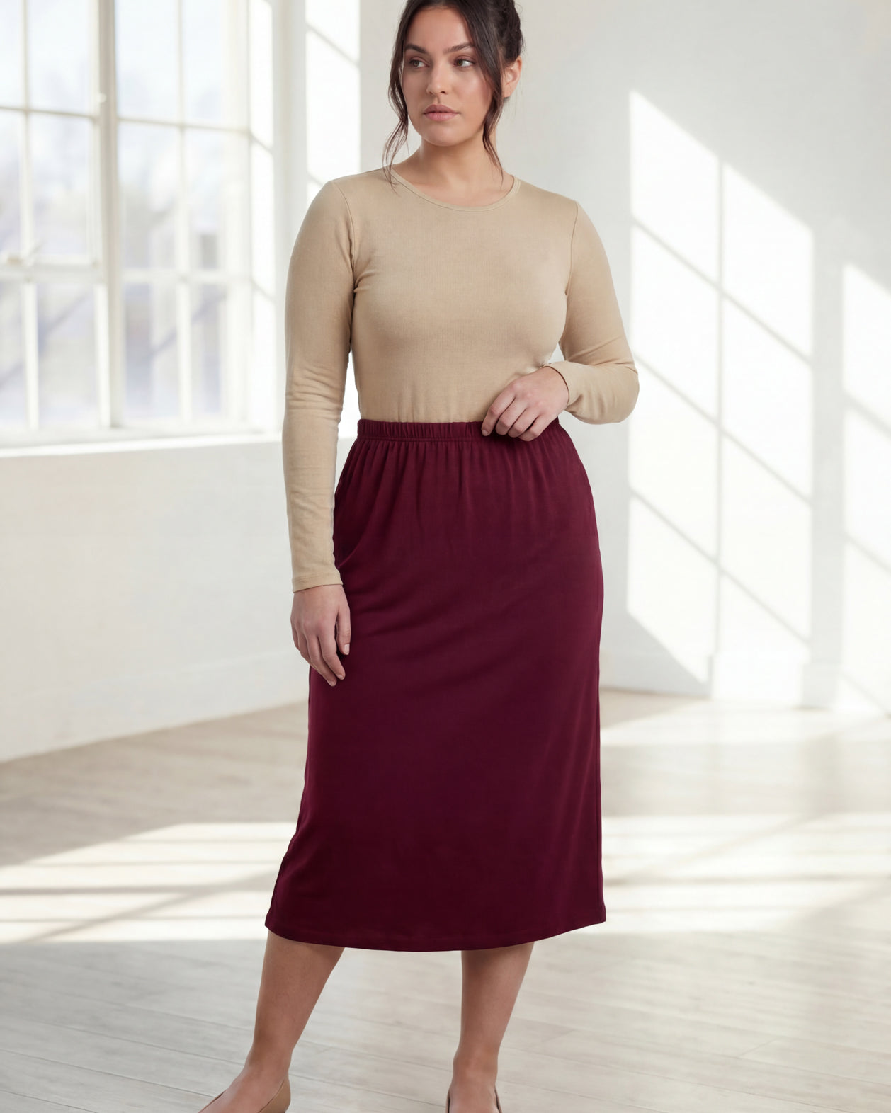 Model wearing Nuggles® 31" Classic Skirt in Burgundy