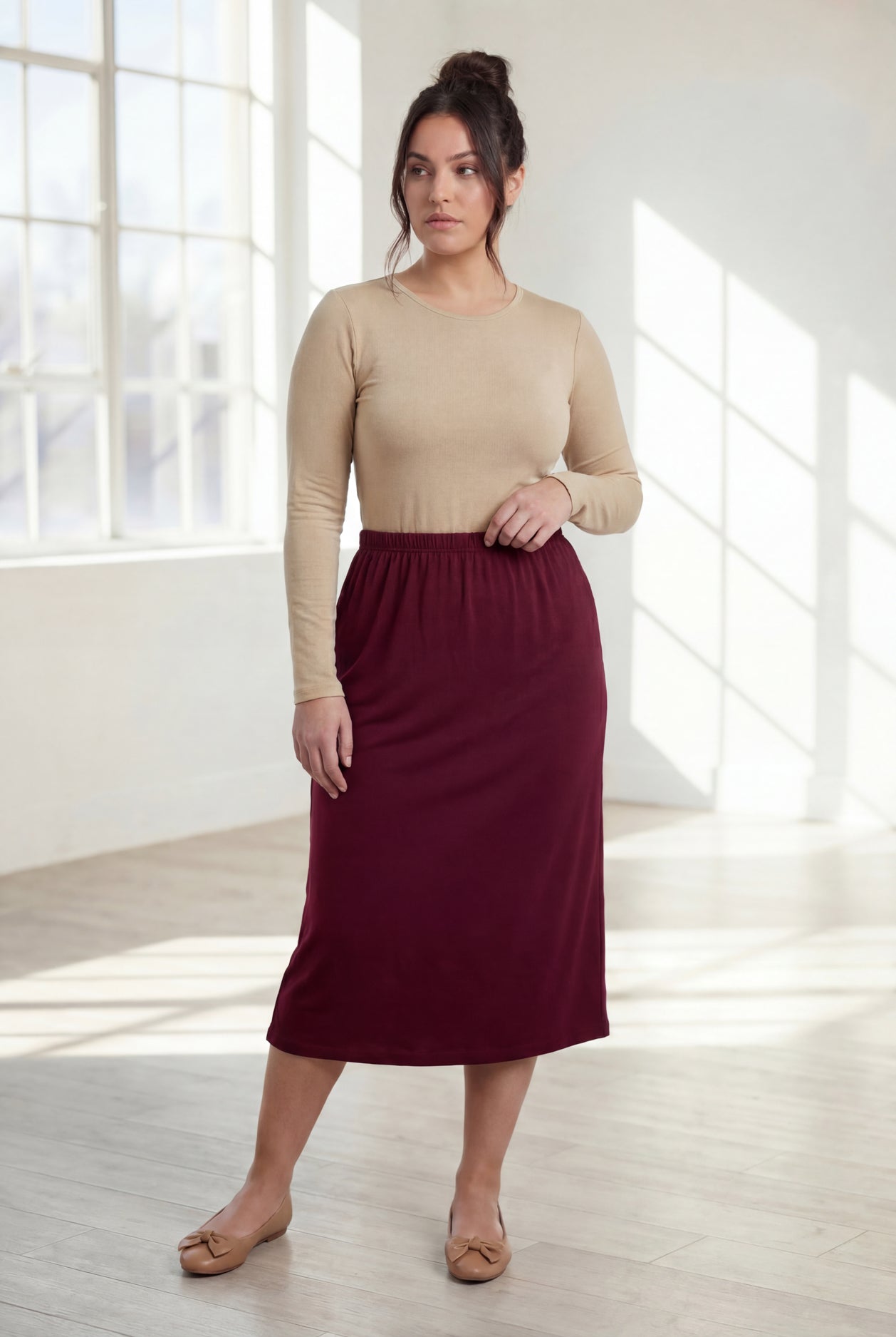 Model wearing Nuggles® 31" Classic Skirt in Burgundy