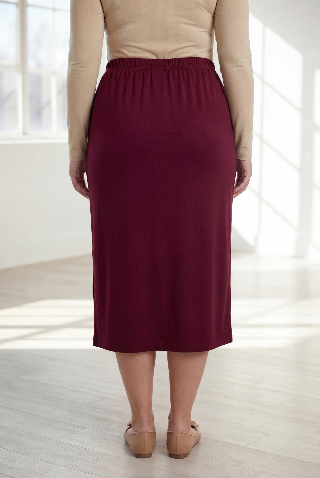 Model wearing Nuggles® 31" Classic Skirt in Burgundy