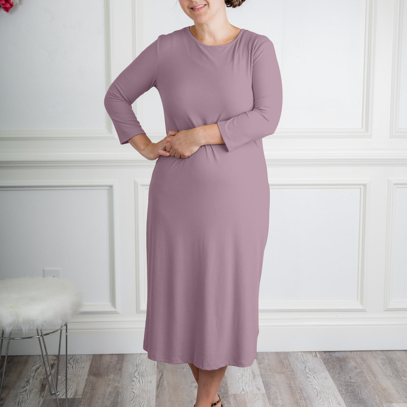 model wearing a ribbed midi dress from Nuggles® with modest 3/4 sleeves and high neckline.