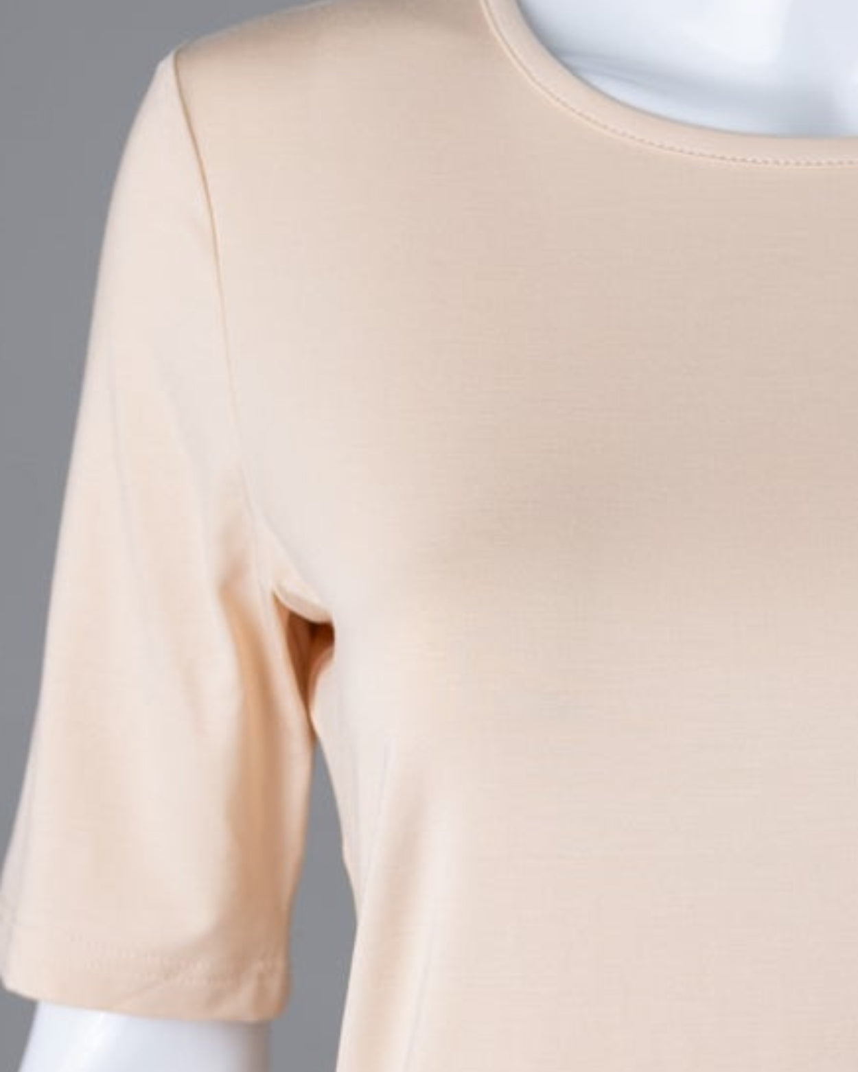Model wearing Nuggles® Half Sleeve Essential Tee in Nude