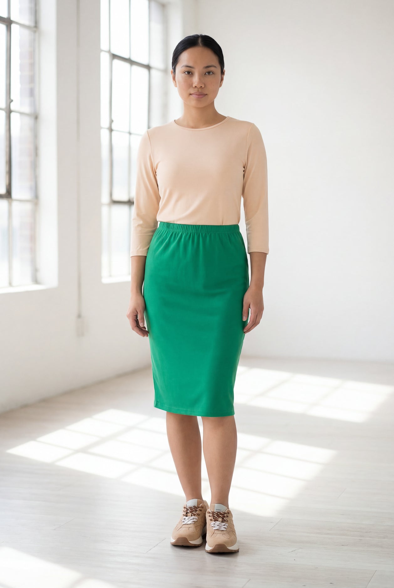 Model wearing Nuggles® 25" Classic Skirt in Kelly Green