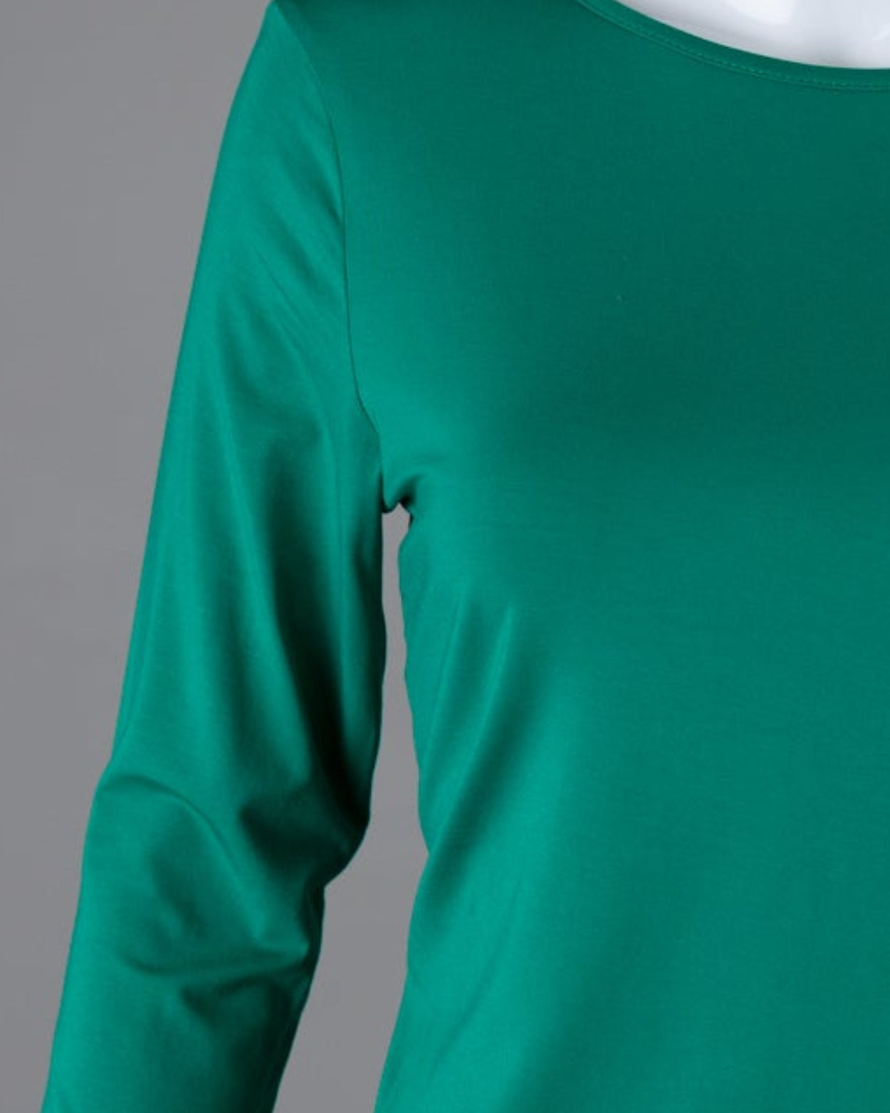 Model wearing Nuggles® 3/4 Essential Tee in Kelly Green
