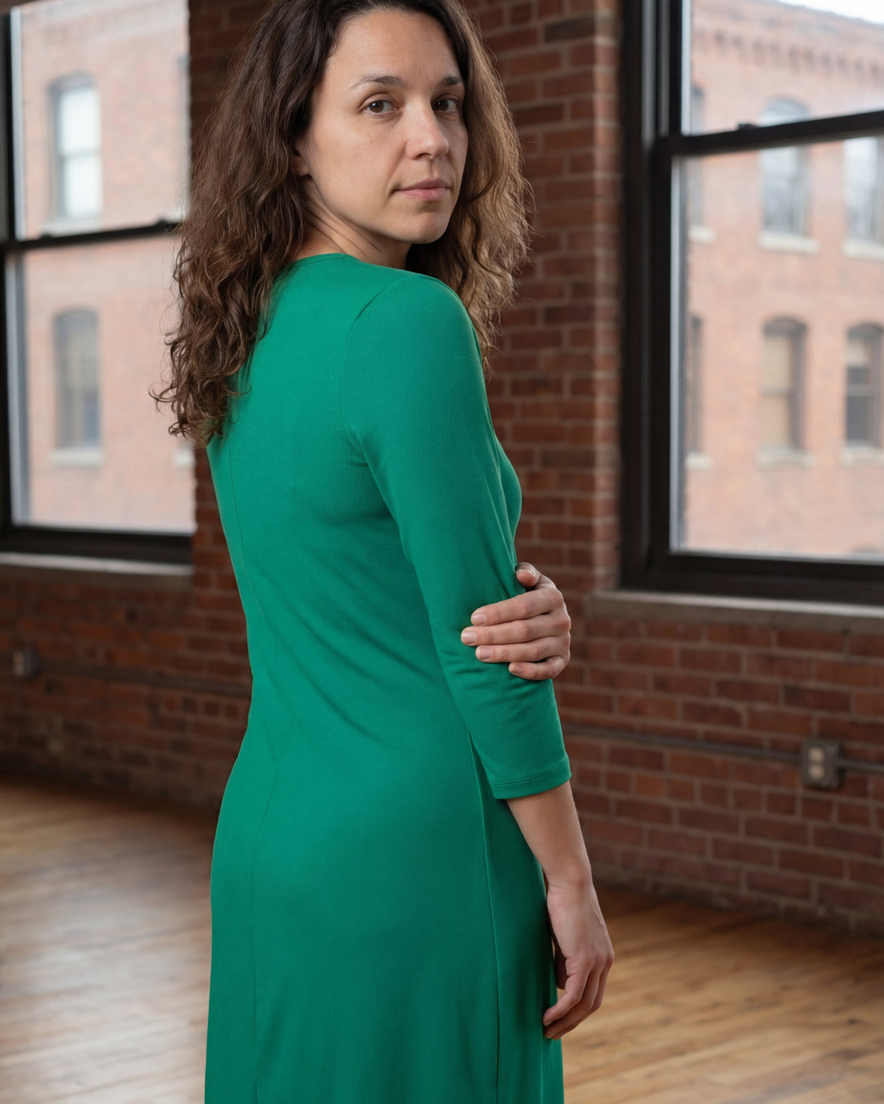 Model wearing Nuggles® Midi Layering Dress in Kelly Green